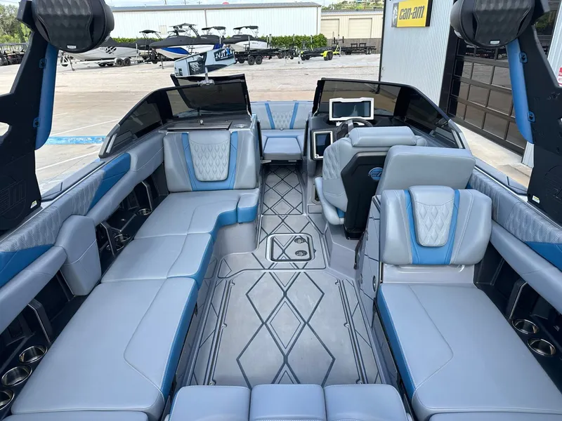 Slide: The Image of Interior of 2024 Malibu M242 boat with luxurious blue upholstery. - 14