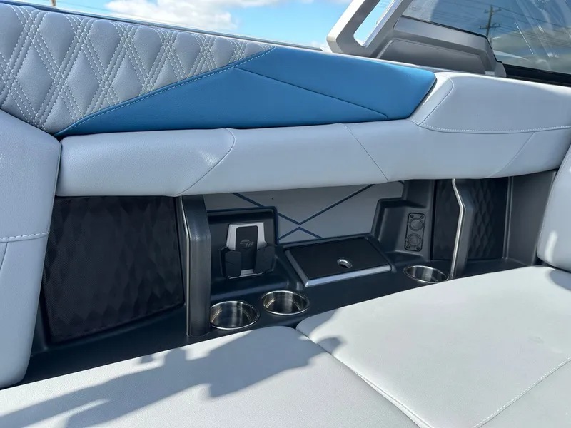 Slide: The Image of 2024 Malibu M242 interior with blue and gray upholstery. - 16