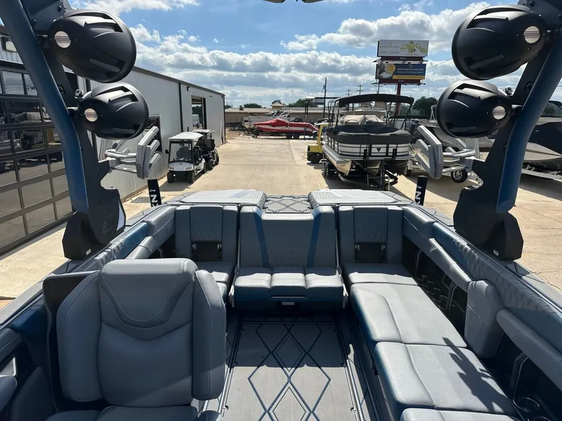 Slide: The Image of Interior of 2024 Malibu M242 boat with luxurious seating. - 25
