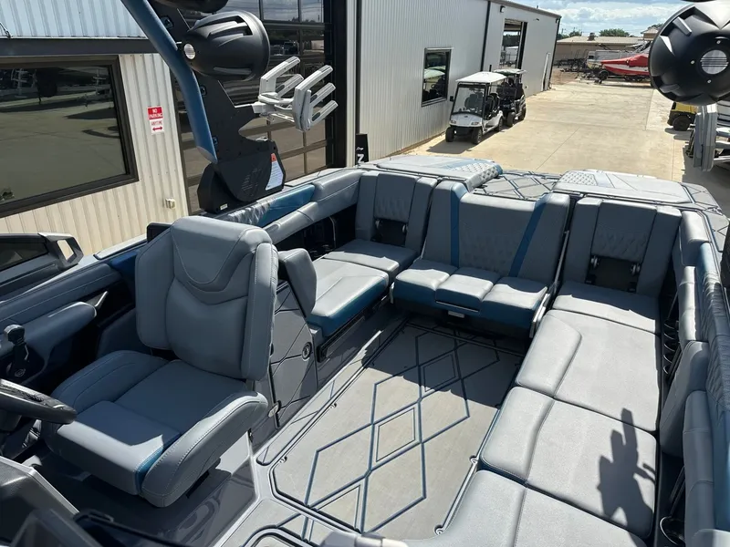 Slide: The Image of Interior of 2024 Malibu M242 boat with luxurious seating. - 27