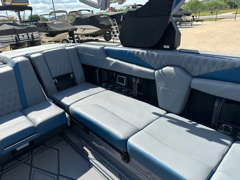 Slide: The Image of Interior of 2024 Malibu M242 boat with luxurious seating. - 28