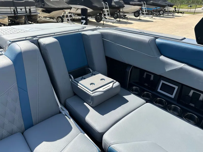 Slide: The Image of Interior of 2024 Malibu M242 boat with luxurious seating. - 30