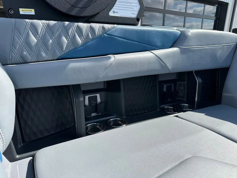 Slide: The Image of Interior of 2024 Malibu M242 with sleek seating and cup holders. - 32