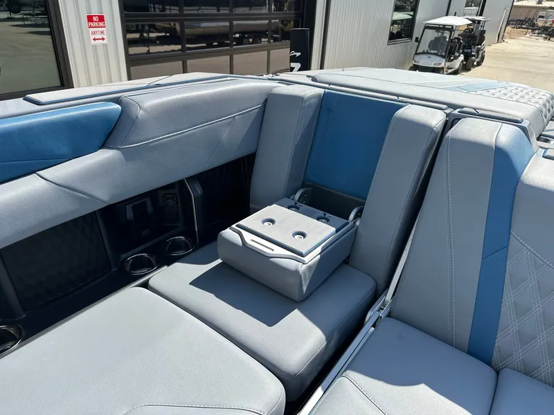 Slide: The Image of 2024 Malibu M242 interior with blue and gray seating. - 33
