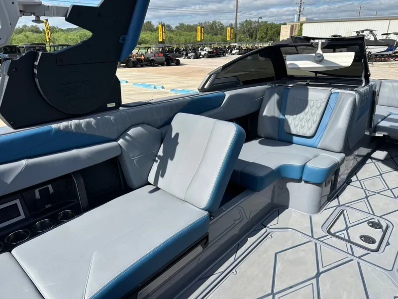 Slide: The Image of Interior of 2024 Malibu M242 with blue and gray seating. - 35