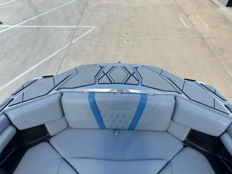 Slide: The Image of Interior of 2024 Malibu M242 boat with gray and blue upholstery. - 38