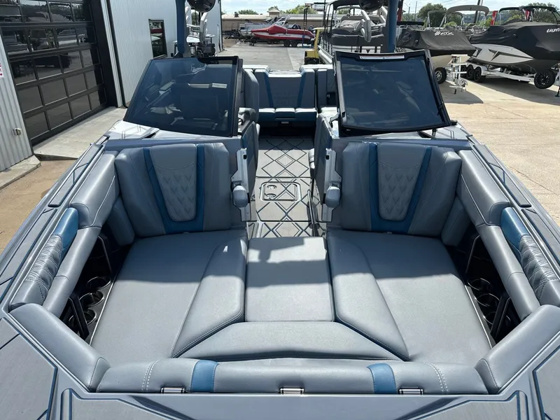 Slide: The Image of 2024 Malibu M242 boat interior with luxurious seating. - 39