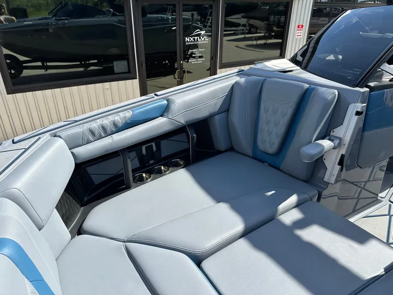 Slide: The Image of Interior of 2024 Malibu M242 boat with luxurious seating. - 40