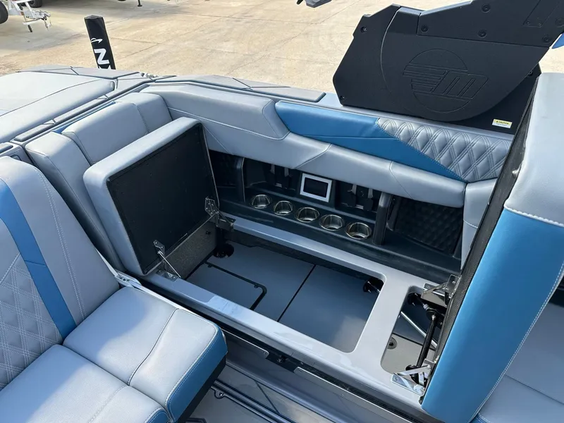 Slide: The Image of 2024 Malibu M242 interior with blue upholstery and storage space. - 46