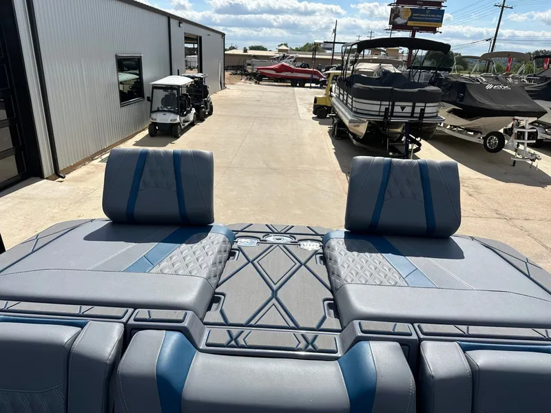 Slide: The Image of 2024 Malibu M242 boat with luxurious outdoor seating area. - 47