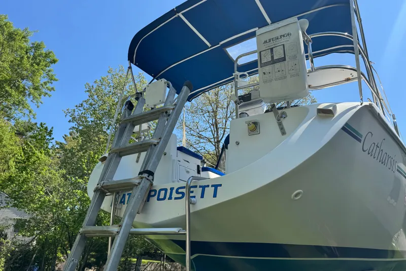 Slide: The Image of Catalina 36 MkII 1996 sailboat with ladder and canopy, docked outdoors. - 15
