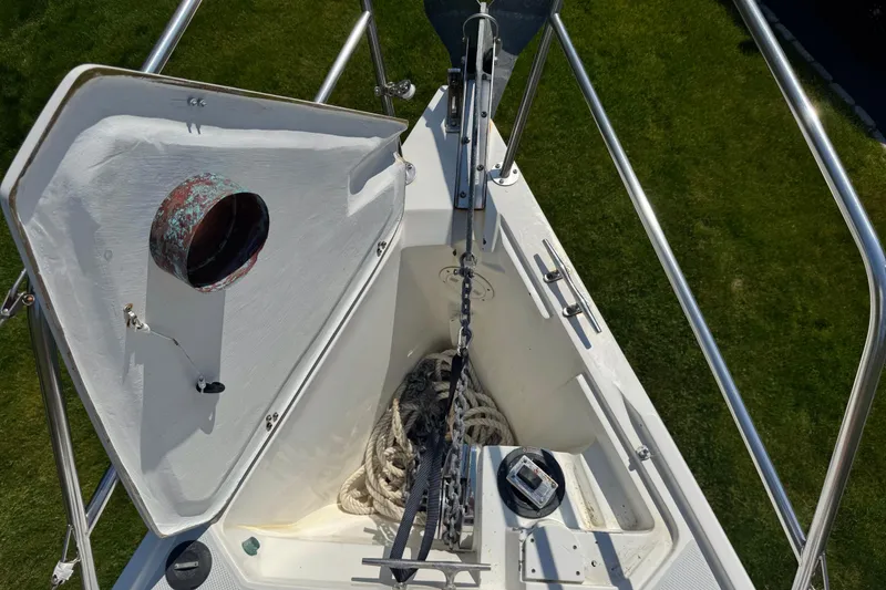 Slide: The Image of Anchor locker of a 1996 Catalina 36 MkII sailboat with chain and rope. - 16