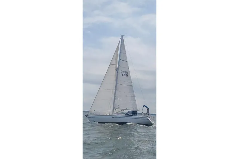 Slide: The Image of Sailing yacht Catalina 36 MkII 1996 on open water under cloudy sky. - 2