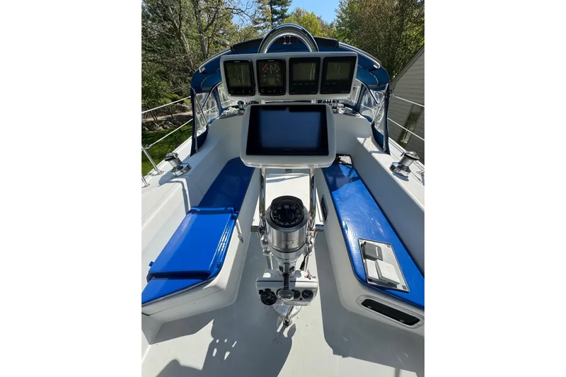 Slide: The Image of Cockpit of a 1996 Catalina 36 MkII sailboat with navigation instruments and blue seating. - 23