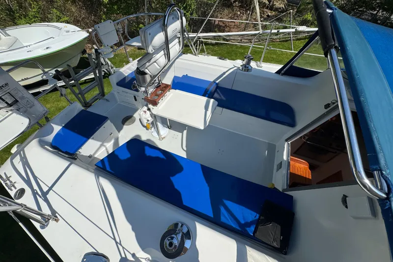 Slide: The Image of Cockpit of 1996 Catalina 36 MkII sailboat with blue cushions and steering wheel. - 24