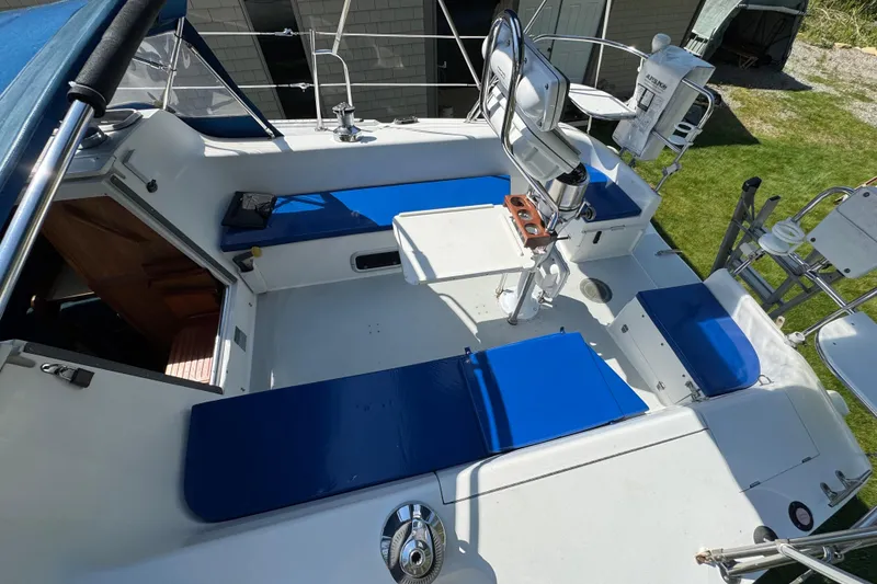 Slide: The Image of Cockpit of 1996 Catalina 36 MkII sailboat with blue cushions and steering wheel. - 25