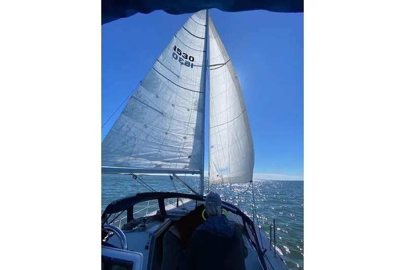 Slide: The Image of Sailing on a 1996 Catalina 36 MkII with full sails under a clear blue sky. - 3