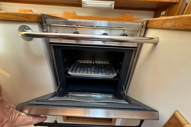 Slide: The Image of Catalina 36 MkII 1996 yacht oven with open door and control knobs. - 35