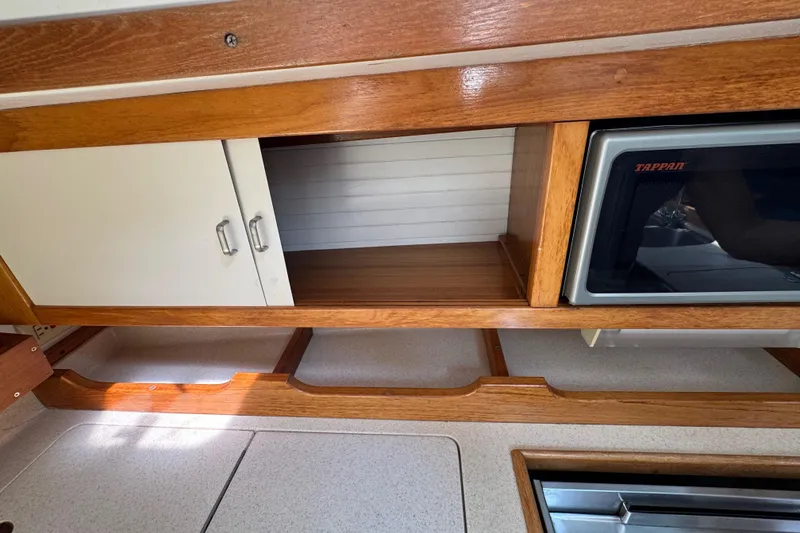 Slide: The Image of Wooden cabinetry and microwave in 1996 Catalina 36 MkII yacht interior. - 36
