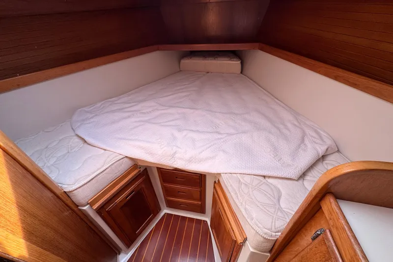 Slide: The Image of Cozy cabin interior of 1996 Catalina 36 MkII sailboat with wooden accents and bedding. - 40