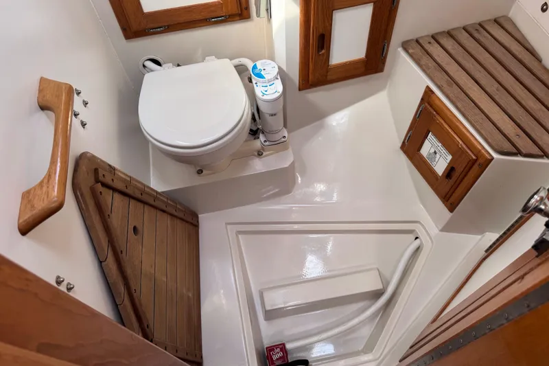 Slide: The Image of Bathroom interior of 1996 Catalina 36 MkII yacht with wooden accents and compact design. - 43