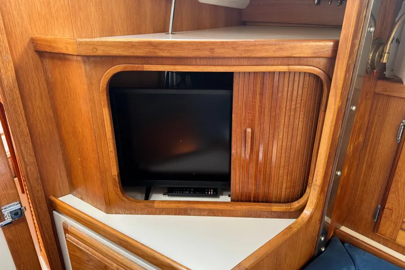 Slide: The Image of Wooden interior of 1996 Catalina 36 MkII yacht with built-in TV cabinet. - 44
