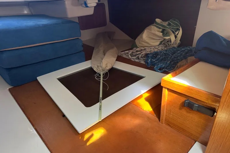 Slide: The Image of Interior of a 1996 Catalina 36 MkII sailboat with cushions and ropes. - 46