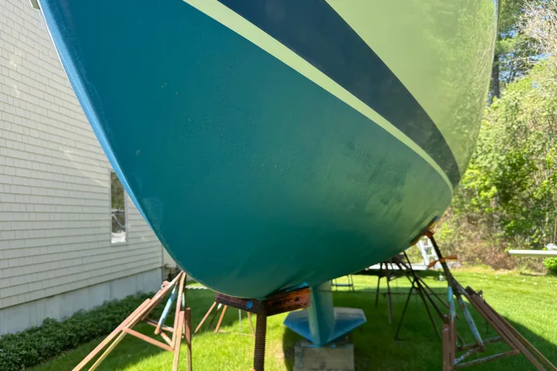 Slide: The Image of Catalina 36 MkII 1996 sailboat hull on stands, side view, outdoors. - 5