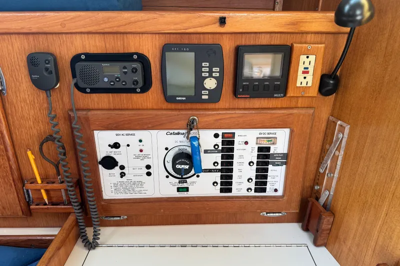 Slide: The Image of Control panel of a 1996 Catalina 36 MkII sailboat with navigation and communication equipment. - 52