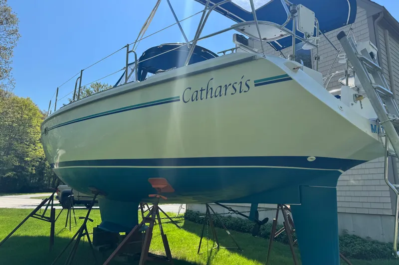 Slide: The Image of 1996 Catalina 36 MkII sailboat named "Catharsis" on stands, side view. - 9