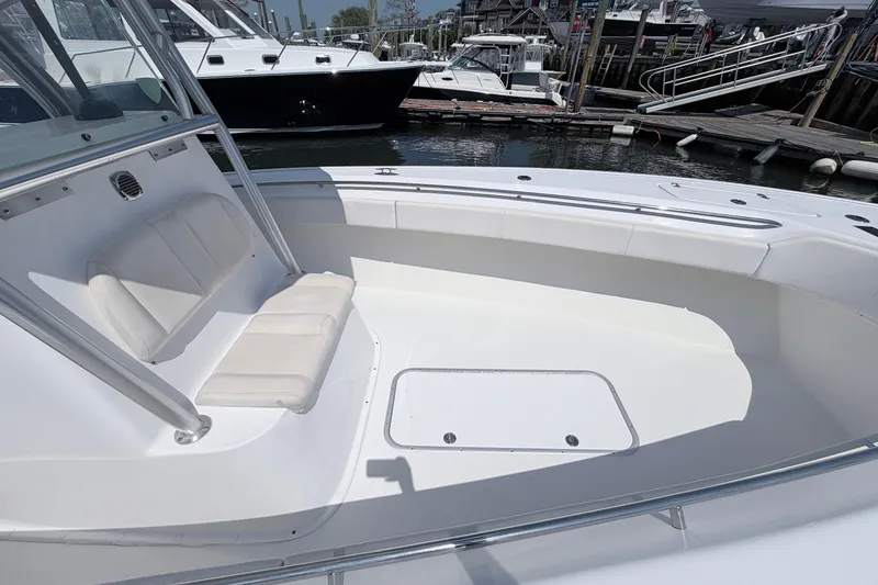 Slide: The Image of 2018 Cape Horn 31 T boat with spacious seating, docked at a marina. - 11