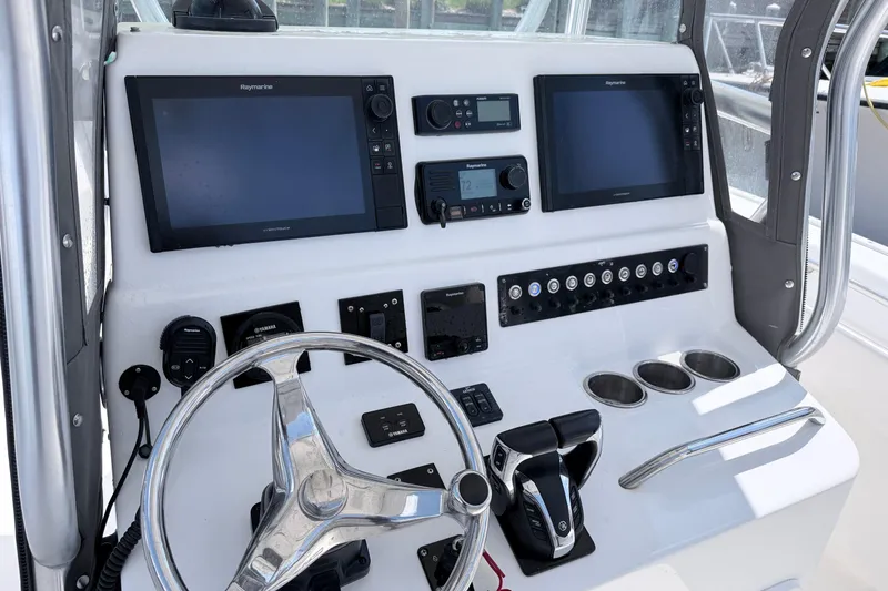 Slide: The Image of 2018 Cape Horn 31 T boat dashboard with dual Raymarine displays and controls. - 13