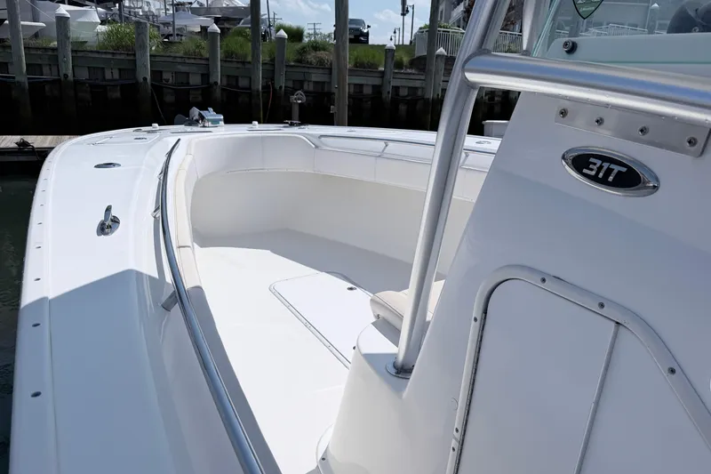 Slide: The Image of 2018 Cape Horn 31 T boat, sleek white deck, docked at marina. - 14