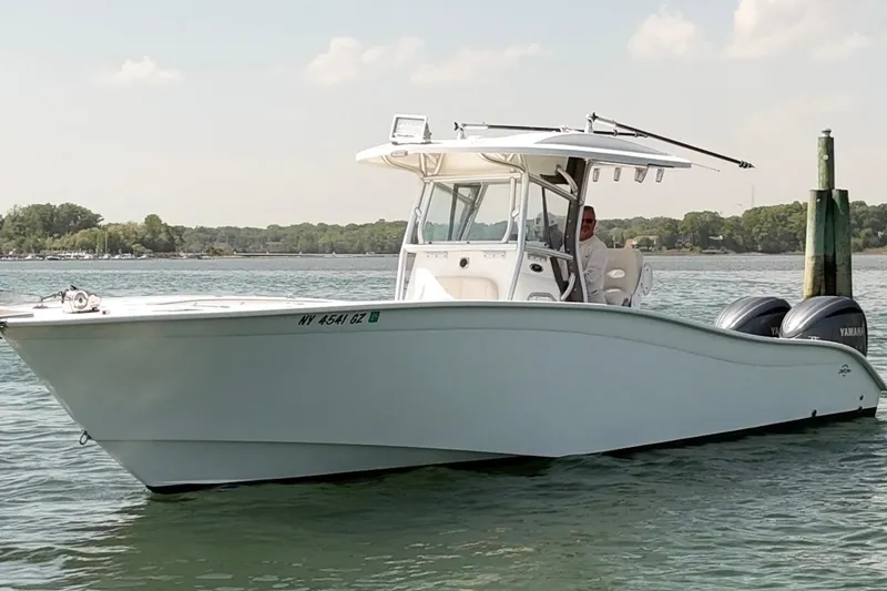 Slide: The Image of 2018 Cape Horn 31 T boat on water with twin Yamaha engines. - 4