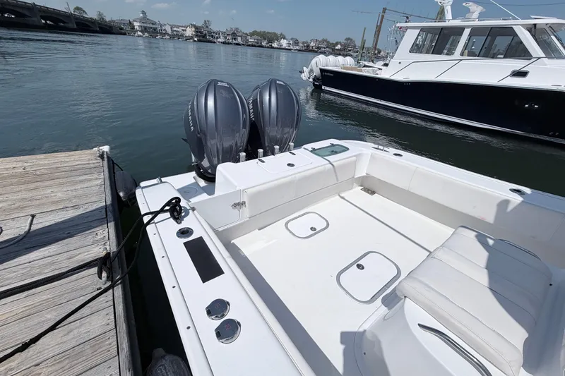 Slide: The Image of 2018 Cape Horn 31 T boat docked, featuring dual Yamaha outboard engines. - 7