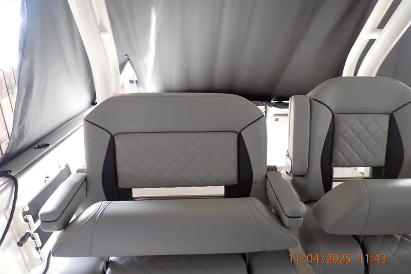 Slide: The Image of 2023 Pursuit S 328 Sport boat interior with luxurious gray seating and quilted design. - 5