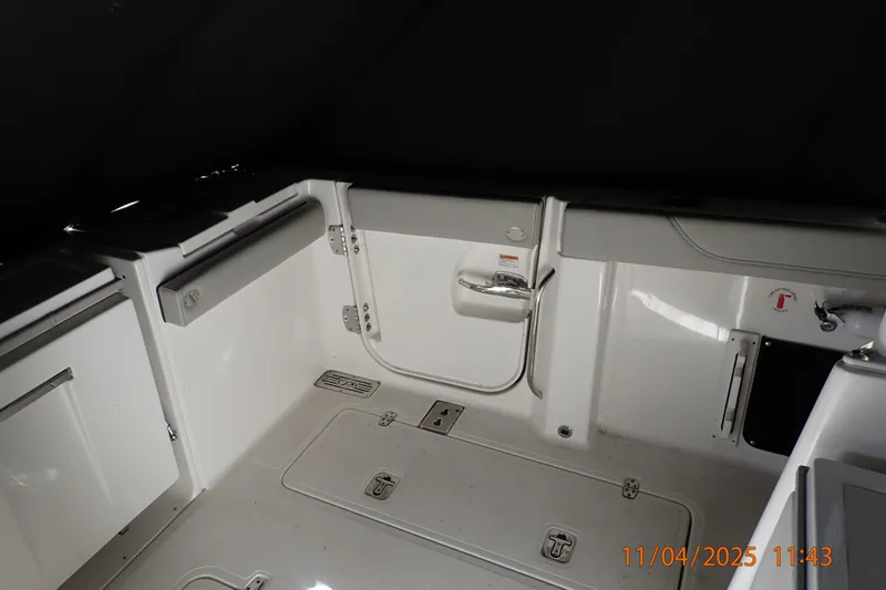 Slide: The Image of 2023 Pursuit S 328 Sport boat interior with storage compartments and seating. - 8
