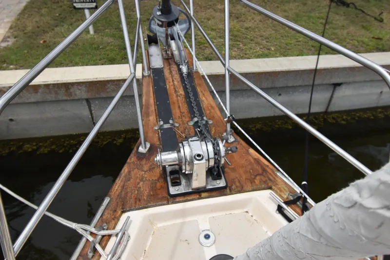 Slide: The Image of Bow of a 1994 Island Packet 32 sailboat with anchor windlass and railing. - 3