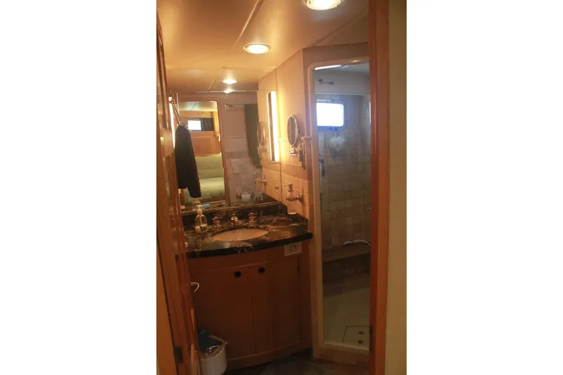 Slide: The Image of Bathroom interior of 1999 Grand Alaskan Pilothouse yacht with shower and vanity. - 116