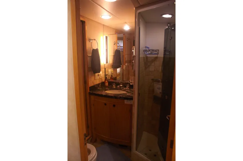 Slide: The Image of Bathroom interior of 1999 Grand Alaskan Pilothouse yacht with shower and vanity. - 120