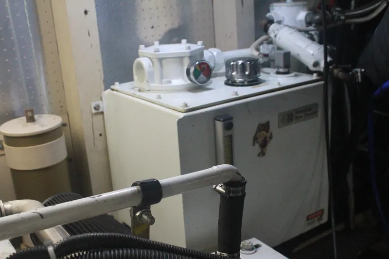 Slide: The Image of Engine room of a 1999 Grand Alaskan Pilothouse with mechanical equipment. - 138