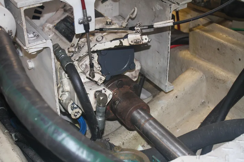 Slide: The Image of Engine compartment of a 1999 Grand Alaskan Pilothouse boat, showing mechanical components. - 148