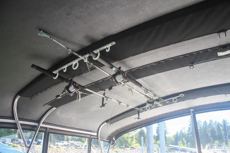 Slide: The Image of Fishing rods stored on the ceiling of a 1999 Grand Alaskan Pilothouse boat. - 158