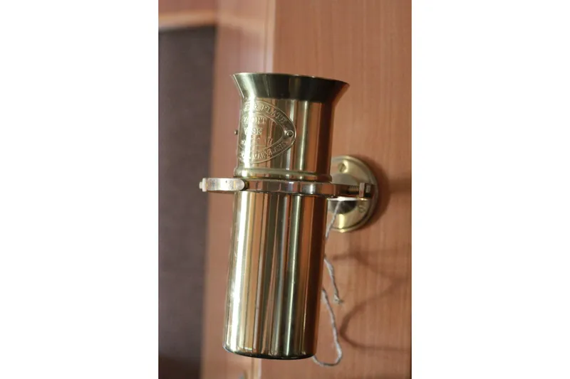 Slide: The Image of Brass nautical whistle on 1999 Grand Alaskan Pilothouse boat interior wall. - 163