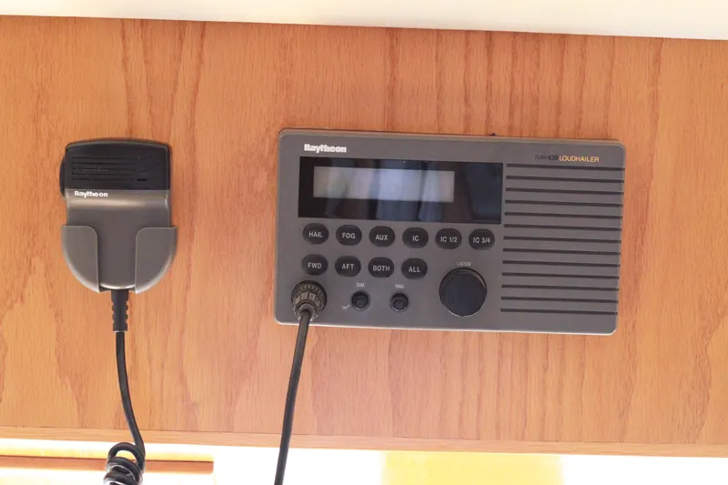 Slide: The Image of Raytheon loudhailer system in 1999 Grand Alaskan Pilothouse boat, mounted on wooden panel. - 175