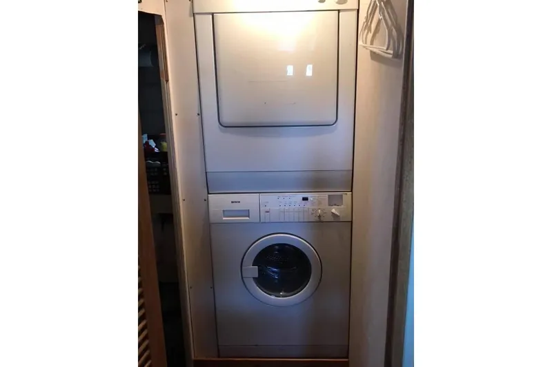 Slide: The Image of Stacked washer and dryer in 1999 Grand Alaskan Pilothouse yacht. - 18