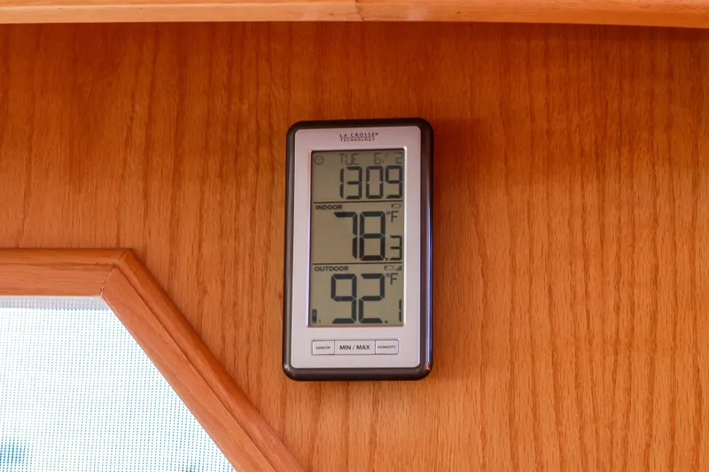 Slide: The Image of Digital thermometer on 1999 Grand Alaskan Pilothouse, displaying indoor and outdoor temperatures. - 181