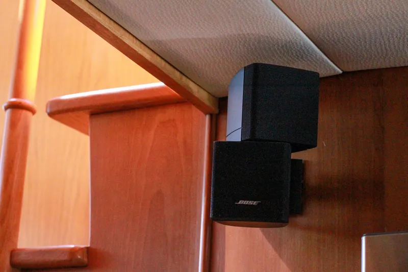 Slide: The Image of Bose speakers mounted on wooden interior of 1999 Grand Alaskan Pilothouse yacht. - 184