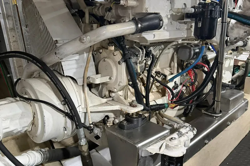 Slide: The Image of Engine room of a 1999 Grand Alaskan Pilothouse yacht, showcasing mechanical components. - 39