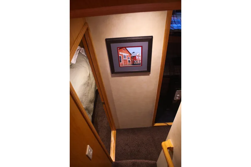 Slide: The Image of 1999 Grand Alaskan Pilothouse yacht "Knot to Worry" docked in a marina. - 47